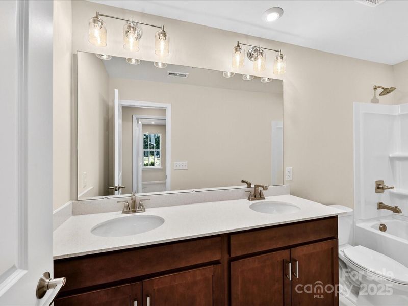 Secondary Bedroom with Dual Vanity.