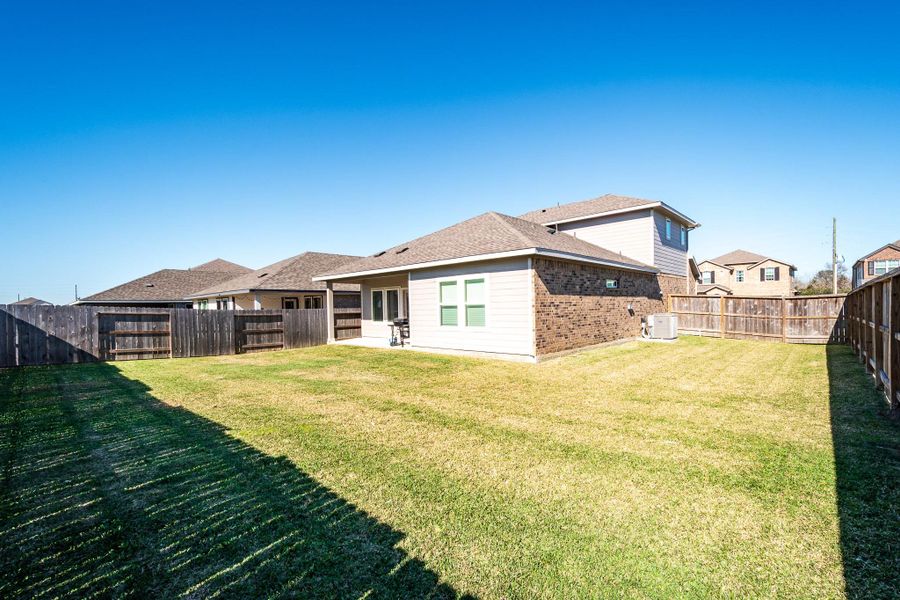 Exterior details and patio area of a home in Heights of Barbers Hill, Baytown (Image 31).