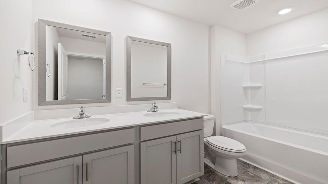 Furnished interior view inside a new home in Lakestone, Woodruff (Image 11).