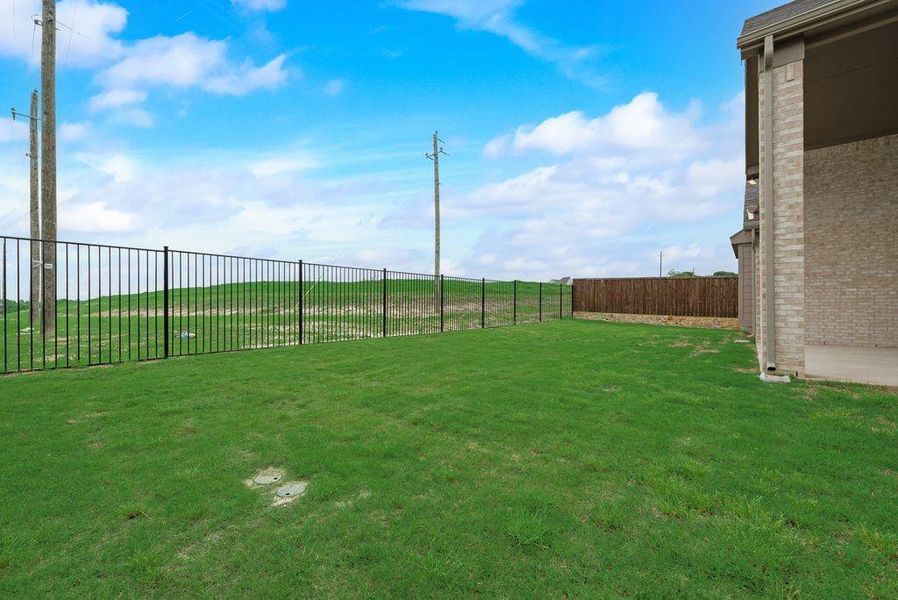 Exterior details and patio area of a home in Breezy Hill, Rockwall (Image 24).