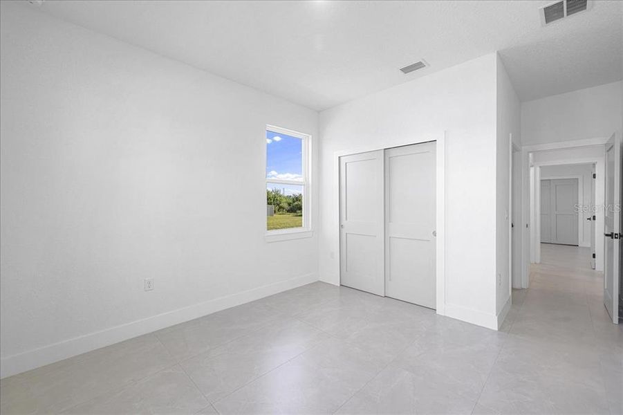 Spacious, unfurnished interior of a new home in , Port Charlotte (Image 27).