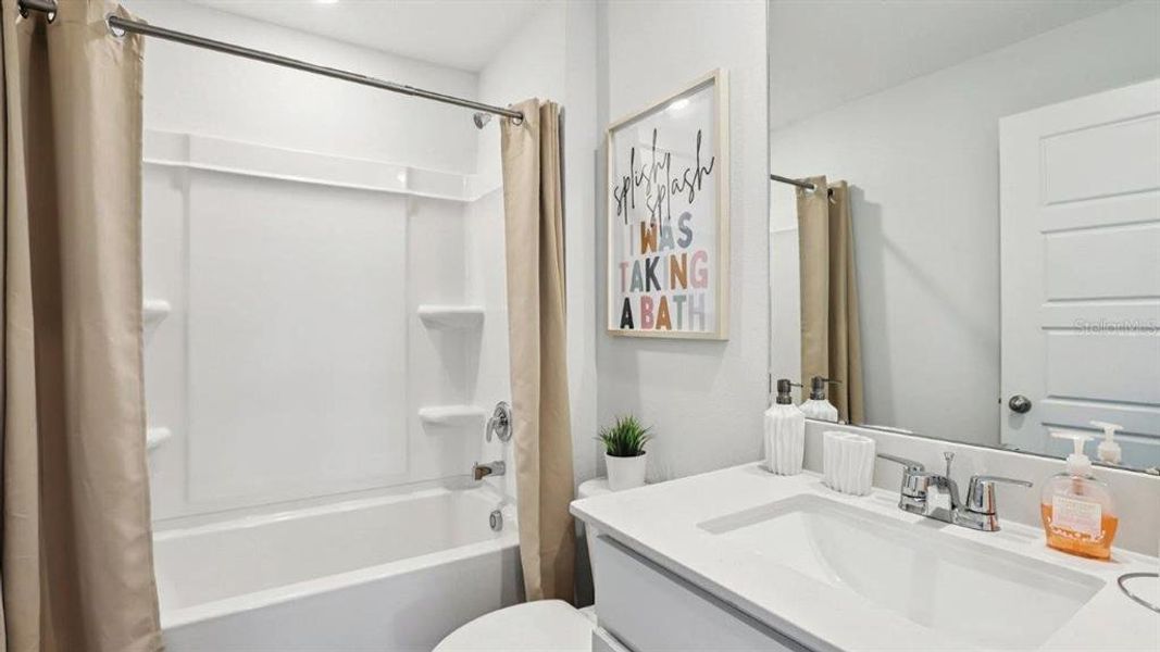Furnished interior view inside a new home in Lake Deer Estates, Poinciana (Image 26).