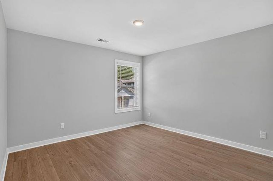 Spacious, unfurnished interior of a new home in The Cottages at East Lanier, Fayetteville (Image 11).