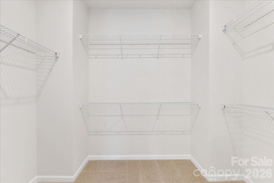 Large Walk-In Closet in the Primary Suite Large Walk-In Closet in the Primary Suite