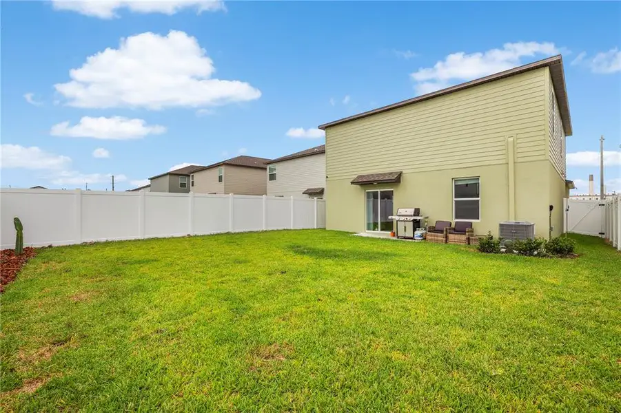 Exterior details and patio area of a home in Cypress Point at Lake Parker, Lakeland (Image 3).