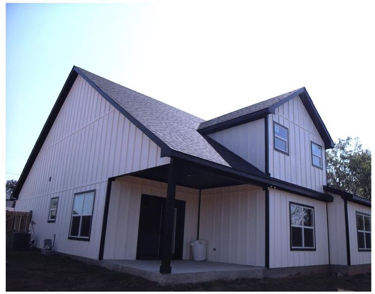 Rear view of property featuring a patio