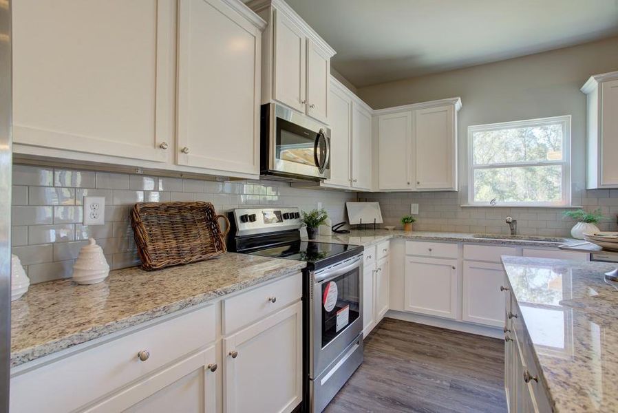 Furnished interior view inside a new home in Sutton's Landing, Statham (Image 6).