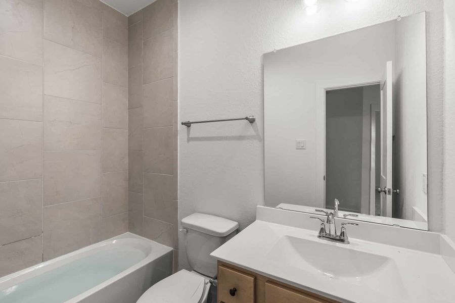 Furnished interior view inside a new home in Meridiana, Manvel (Image 6).