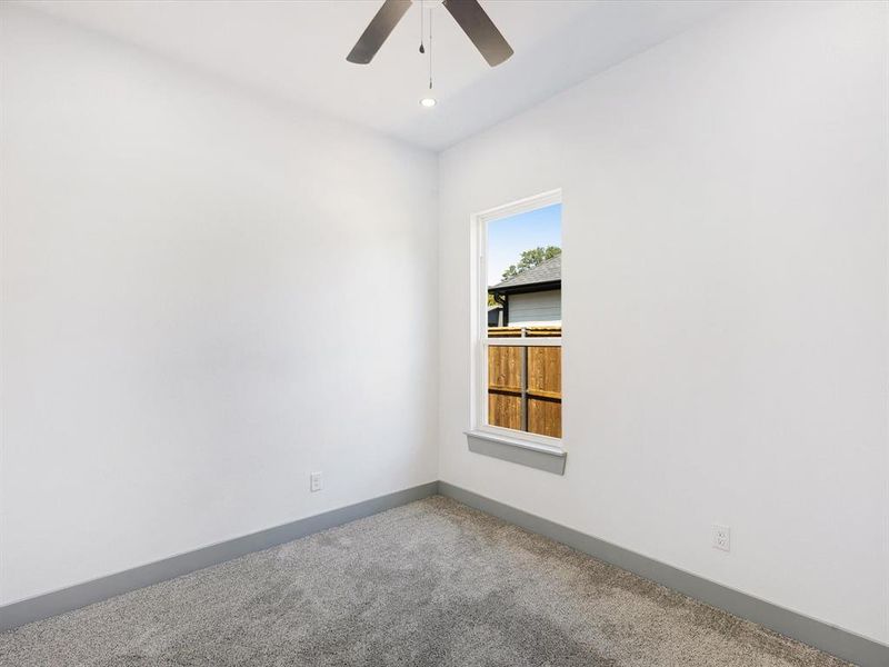 Spare room featuring carpet floors, a ceiling fan, and recessed lighting Spare room featuring carpet floors, a ceiling fan, and recessed lighting