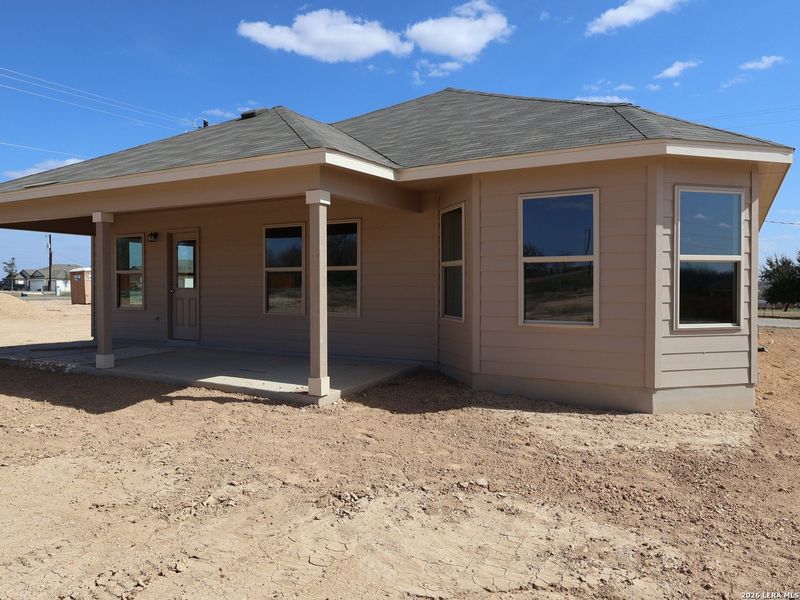 Exterior details and patio area of a home in Chaparral Ranch, Floresville (Image 22).