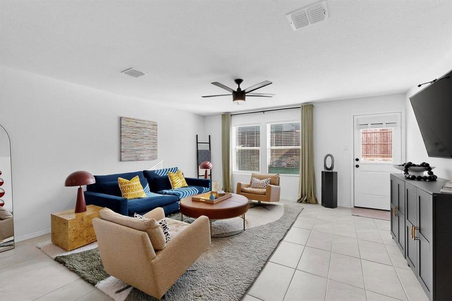 Living area with light tile patterned floors and ceiling fan Living area with light tile patterned floors and ceiling fan