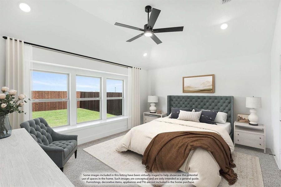 Bedroom with tufted upholstered headboard, ceiling fan, vaulted ceiling, and large windows overlooking backyard