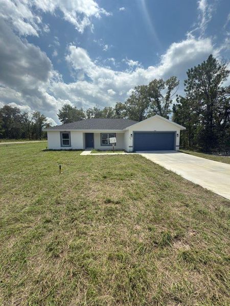 Front exterior of a new home in , Ocklawaha, FL, highlighting curb appeal (Image 17).
