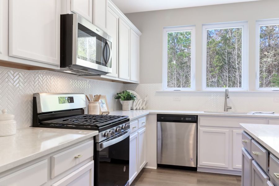 Representative furnished interior of a home built from the Inverness P by True Homes in Homecoming, Ravenel (Image 5).