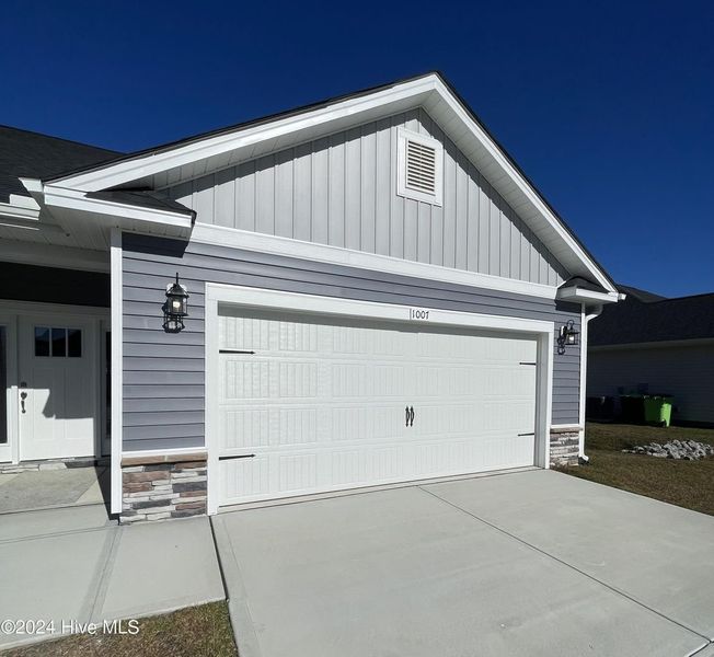 Front exterior of a new home in Athens Acres, New Bern, NC, highlighting curb appeal (Image 17). Front exterior of a new home in Athens Acres, New Bern, NC, highlighting curb appeal (Image 17).
