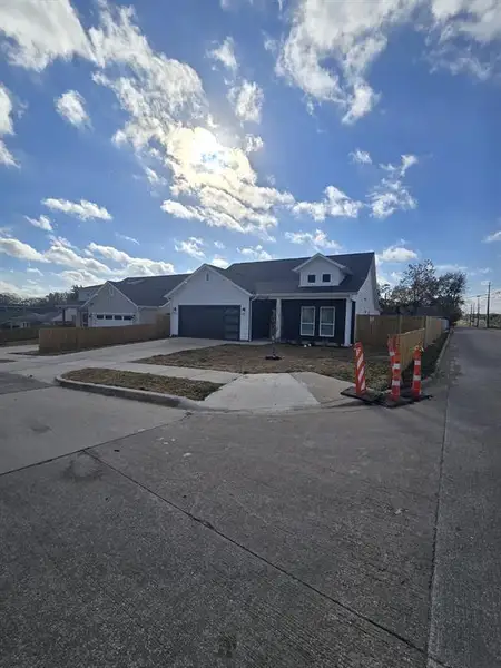 View of front of home featuring driveway and an attached garage