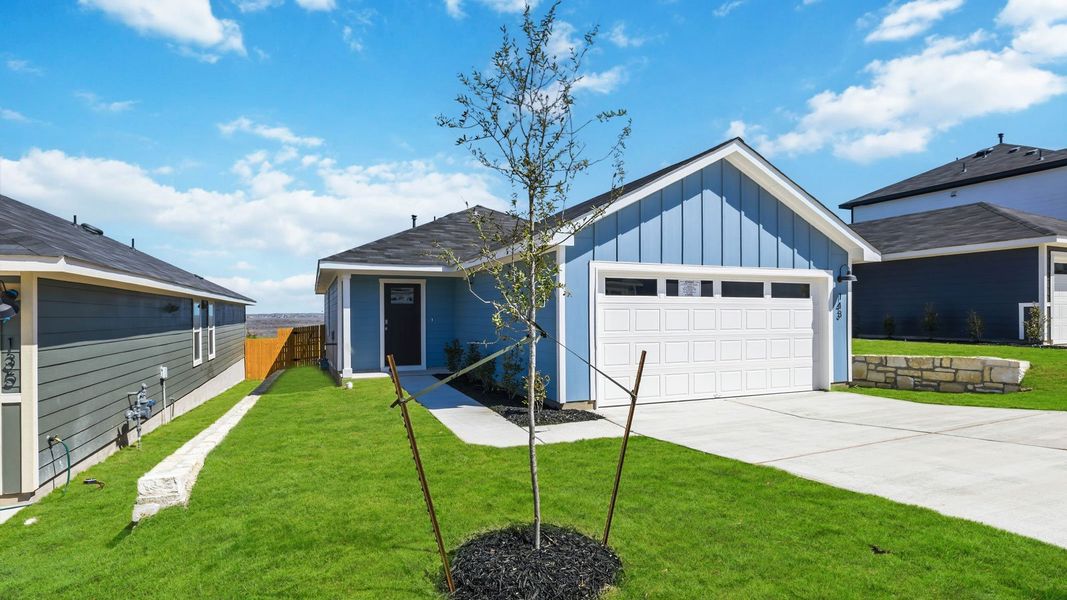 Front exterior of a new home in Wayside, Uhland, TX, highlighting curb appeal (Image 6).
