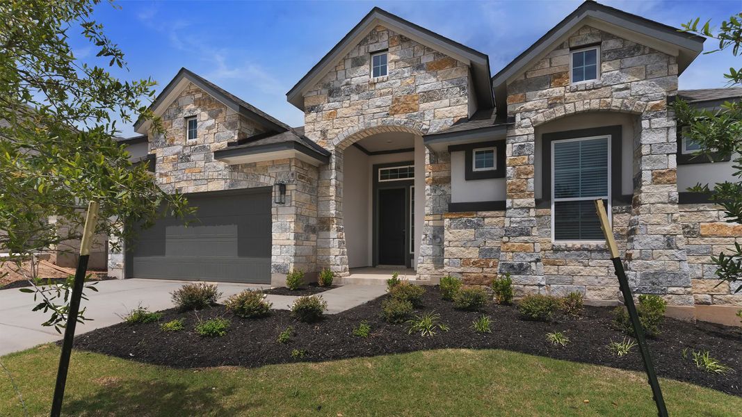 Representative exterior photo of a completed home built from the Michelle by Chesmar Homes in Newhaven, Manor, TX (Image 2). Representative exterior photo of a completed home built from the Michelle by Chesmar Homes in Newhaven, Manor, TX (Image 2).