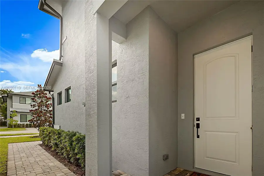 Exterior details and patio area of a home in , Palm City (Image 3).