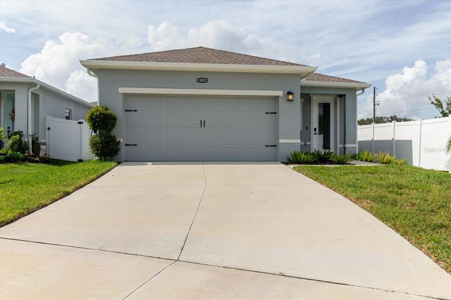 Front exterior of a new home in Conner Crossing, Spring Hill, FL, highlighting curb appeal (Image 22).