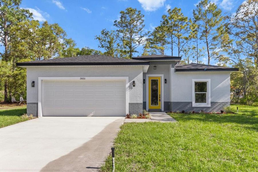 Front exterior of a new home in , Dunnellon, FL, highlighting curb appeal (Image 22).