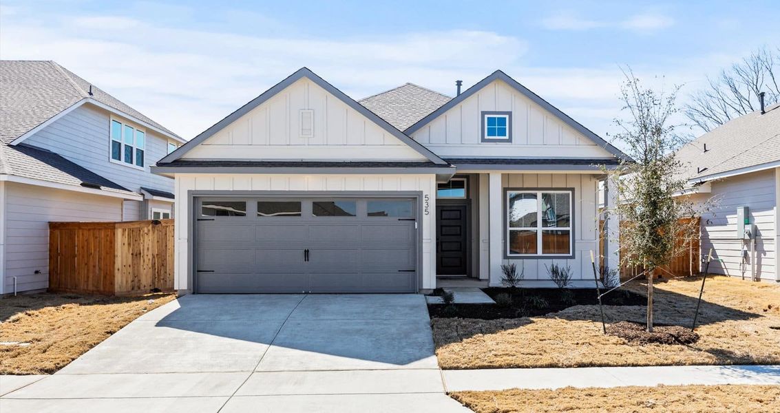 Front exterior of a new home in Trace, San Marcos, TX, highlighting curb appeal (Image 1). Front exterior of a new home in Trace, San Marcos, TX, highlighting curb appeal (Image 1).