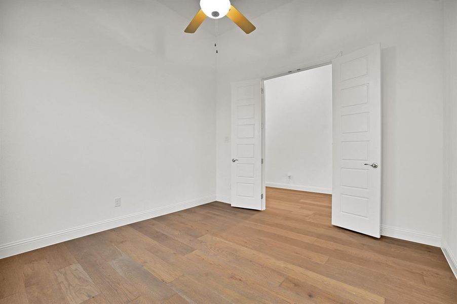 Office with ceiling fan and light wood-type flooring