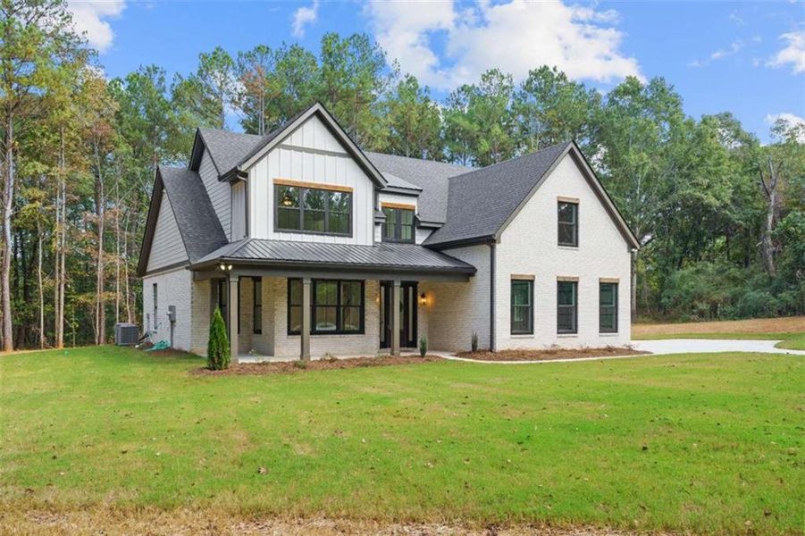 Front exterior of a new home in , Jenkinsburg, GA, highlighting curb appeal (Image 29).