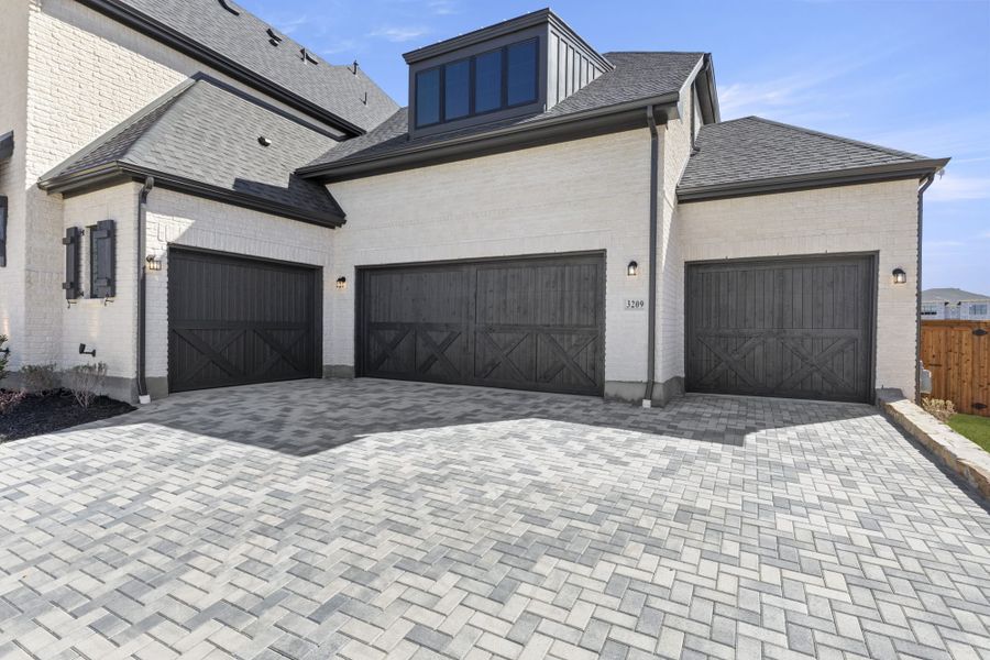 Front exterior of a new home in Mustang Lakes, Celina, TX, highlighting curb appeal (Image 28). Front exterior of a new home in Mustang Lakes, Celina, TX, highlighting curb appeal (Image 28).