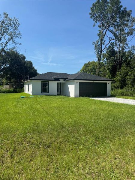 Front exterior of a new home in , Ocala, FL, highlighting curb appeal (Image 2).