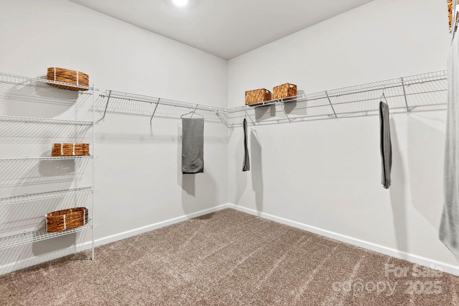 Primary Walk-In Closet Primary Walk-In Closet