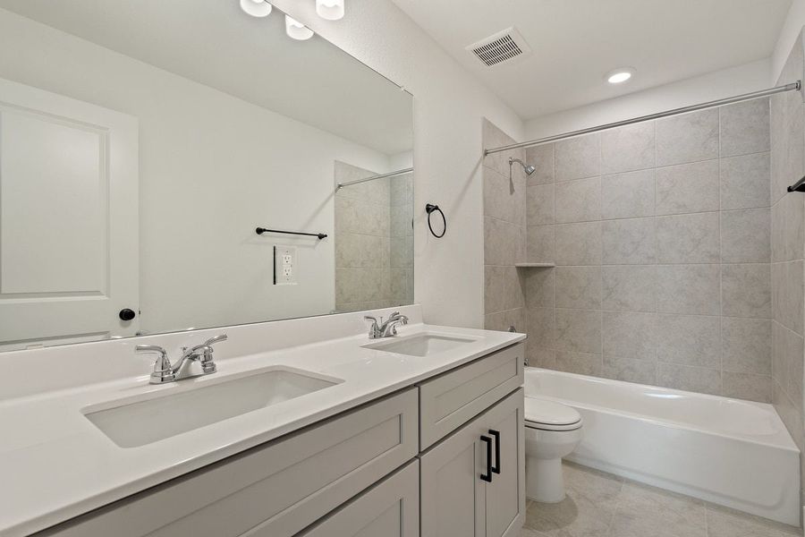 Furnished interior view inside a new home in Crosswinds, Kyle (Image 27).