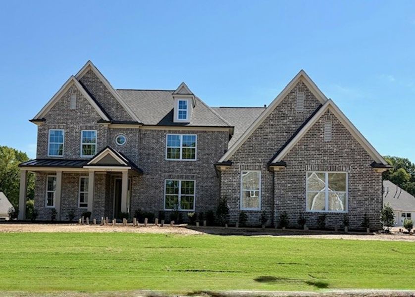 Front exterior of a new home in White Oak, Arlington, TN, highlighting curb appeal (Image 1).