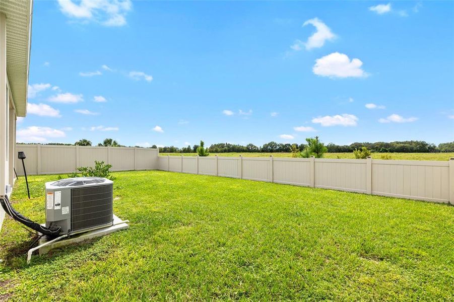Exterior details and patio area of a home in Riverstone, Land O' Lakes (Image 3).
