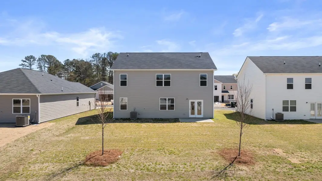 Exterior details and patio area of a home in Champion's Run, Lithonia (Image 2).