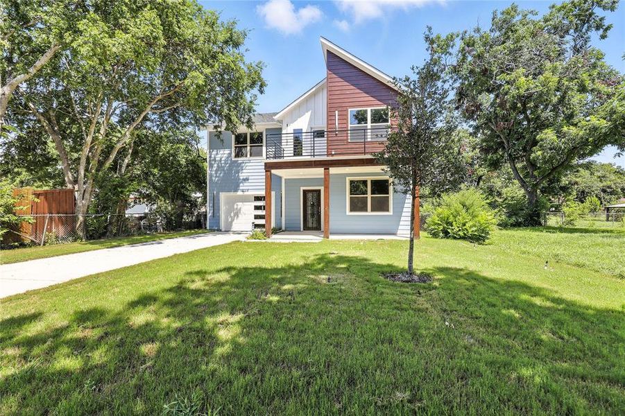 Contemporary home featuring a garage and driveway