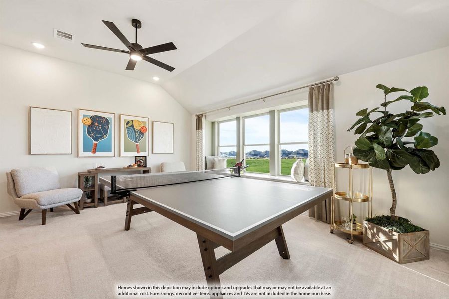 Game room with ping pong table, vaulted ceiling, ceiling fan, and large windows with outdoor views