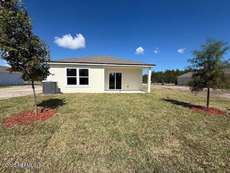 Exterior details and patio area of a home in Grand Reserve, Bunnell (Image 26).
