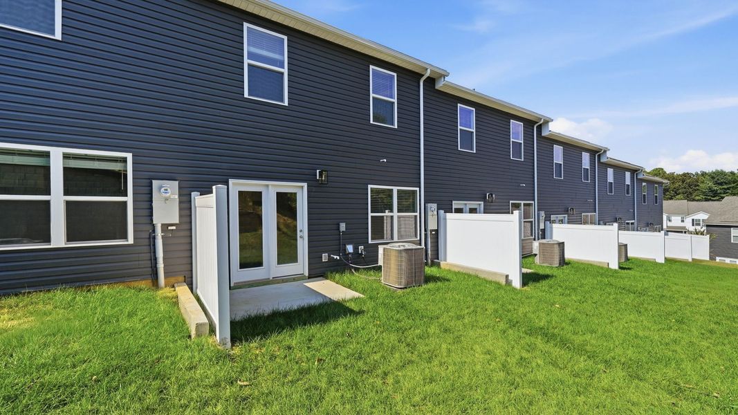 Exterior details and patio area of a home in The Arbor Townhomes, Kingsport (Image 3).