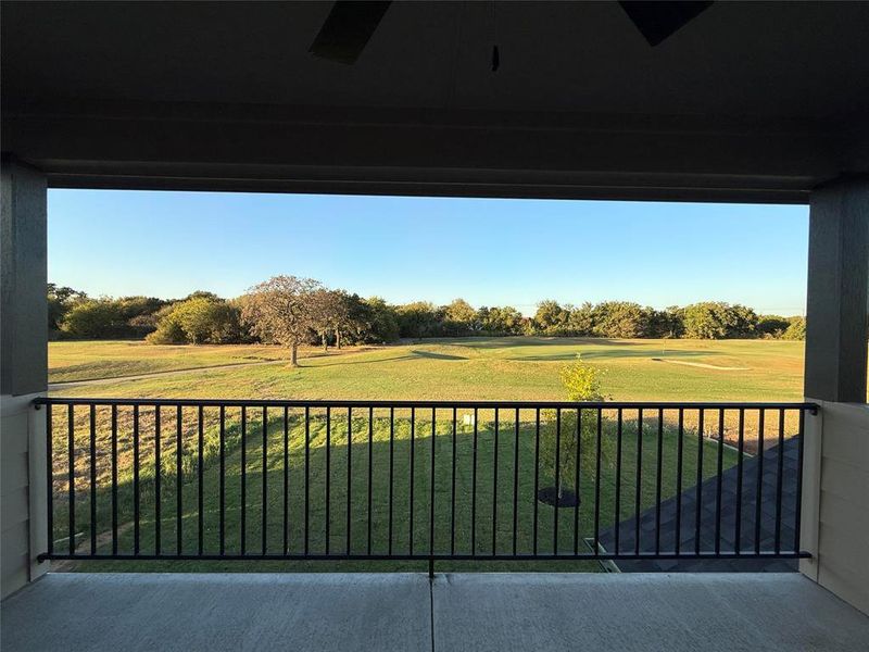 Balcony featuring view of scattered trees and golf course view Balcony featuring view of scattered trees and golf course view