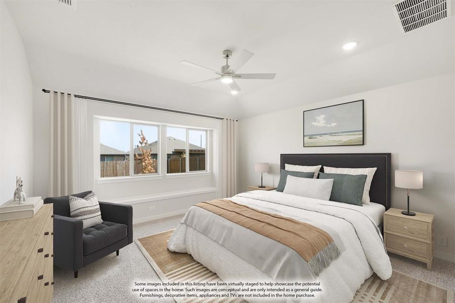 Bedroom with dark upholstered headboard, ceiling fan, carpet flooring, and large window with natural light