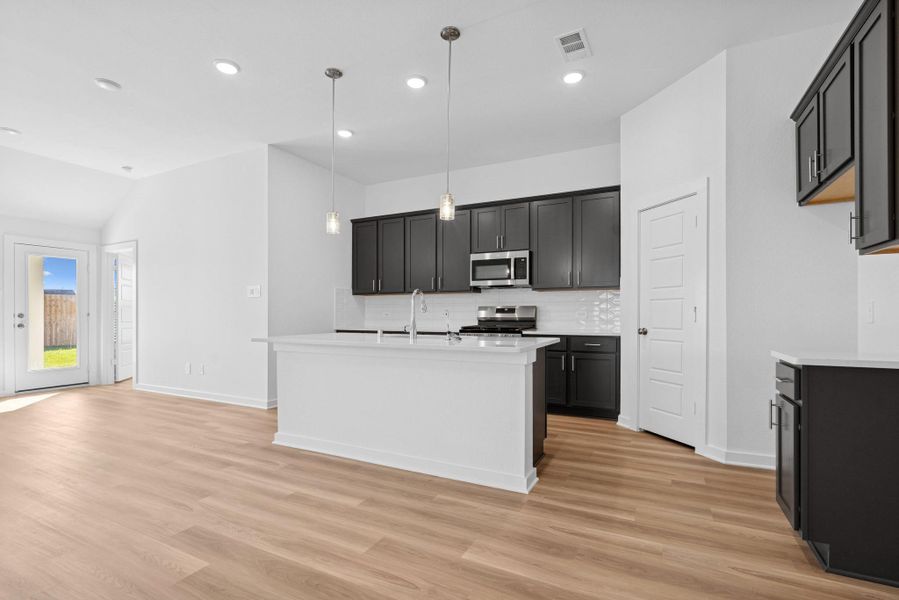Furnished interior view inside a new home in Pinewood at Grand Texas, New Caney (Image 7).