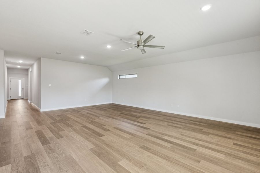 Living and Dining Rooms in the Oscar home plan by Trophy Signature Homes – REPRESENTATIVE PHOTO