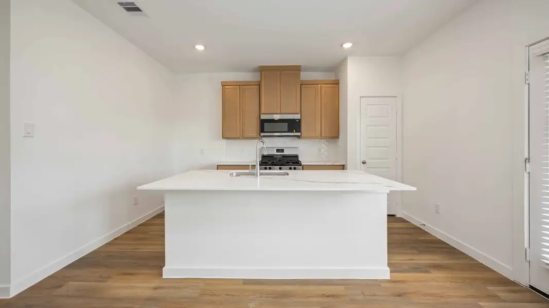 Furnished interior view inside a new home in Grand West, Houston (Image 3).