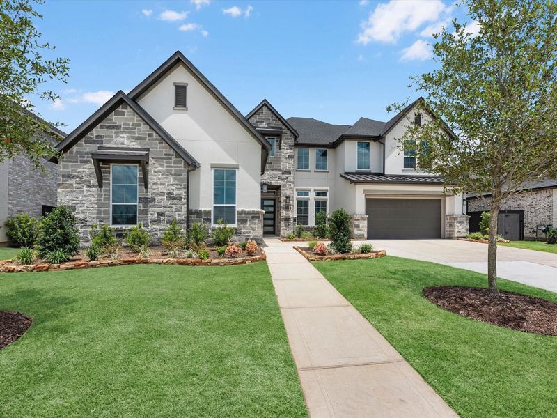 Front exterior of a new home in Harvest Green, Richmond, TX, highlighting curb appeal (Image 16). Front exterior of a new home in Harvest Green, Richmond, TX, highlighting curb appeal (Image 16).