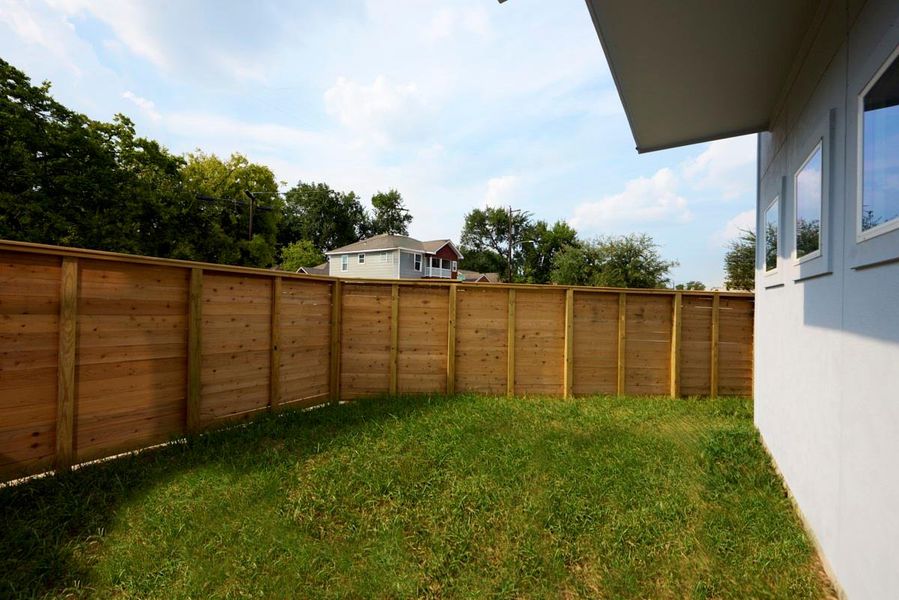 Enjoy your own private oasis in this beautifully fenced backyard. Whether you're hosting a barbecue, relaxing with a book, or playing with your pets, this outdoor space offers a peaceful, secure retreat. Enjoy your own private oasis in this beautifully fenced backyard. Whether you're hosting a barbecue, relaxing with a book, or playing with your pets, this outdoor space offers a peaceful, secure retreat.