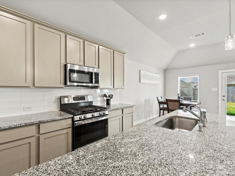 Kitchen and dining area with easy access to the covered patio.