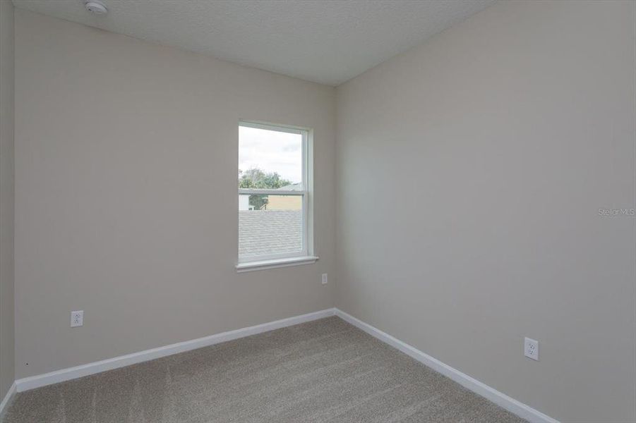 Spacious, unfurnished interior of a new home in Serenade at Ovation, Winter Garden (Image 23).
