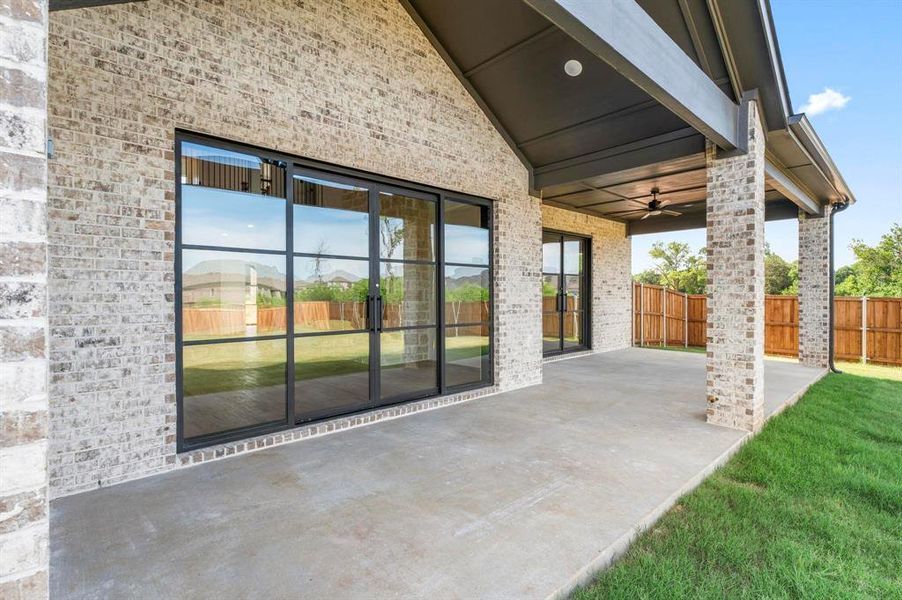 View of patio featuring ceiling fan