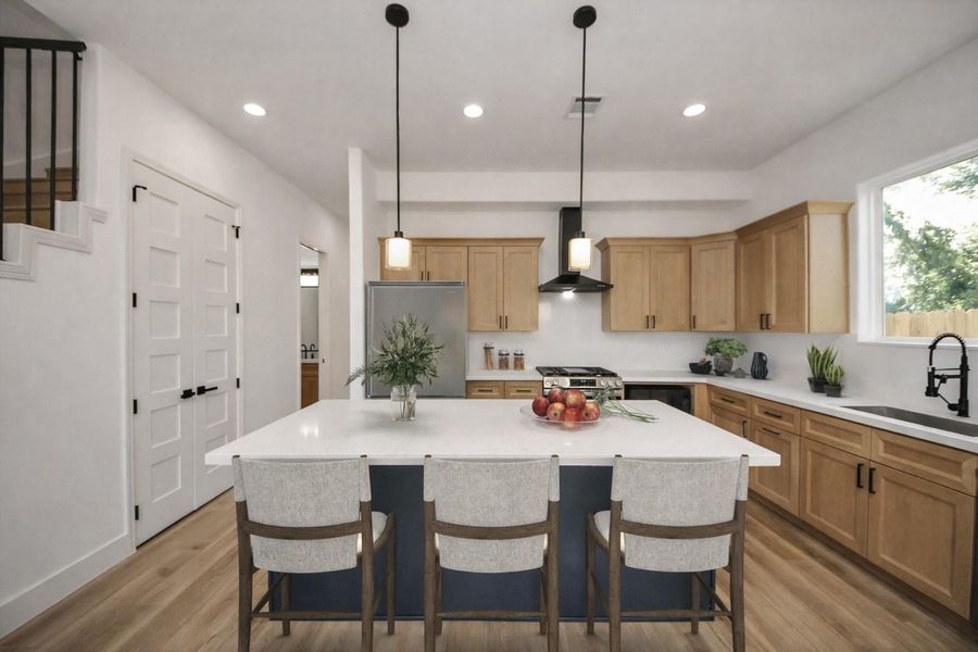 Beautiful kitchen with a large island, ample seating, and warm modern finishes. Open layout and natural light make it perfect for everyday living and entertaining.